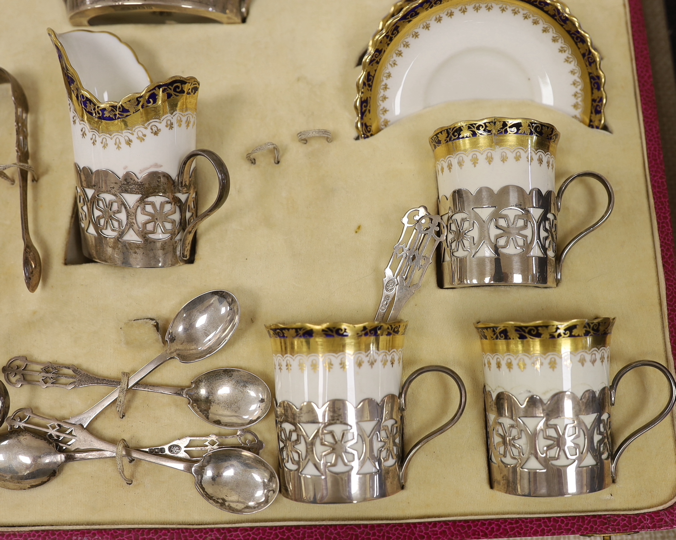 A cased George Jones Crescent China silver mounted coffee set, marks for Alexander Clark Co Ltd Sheffield 1928
